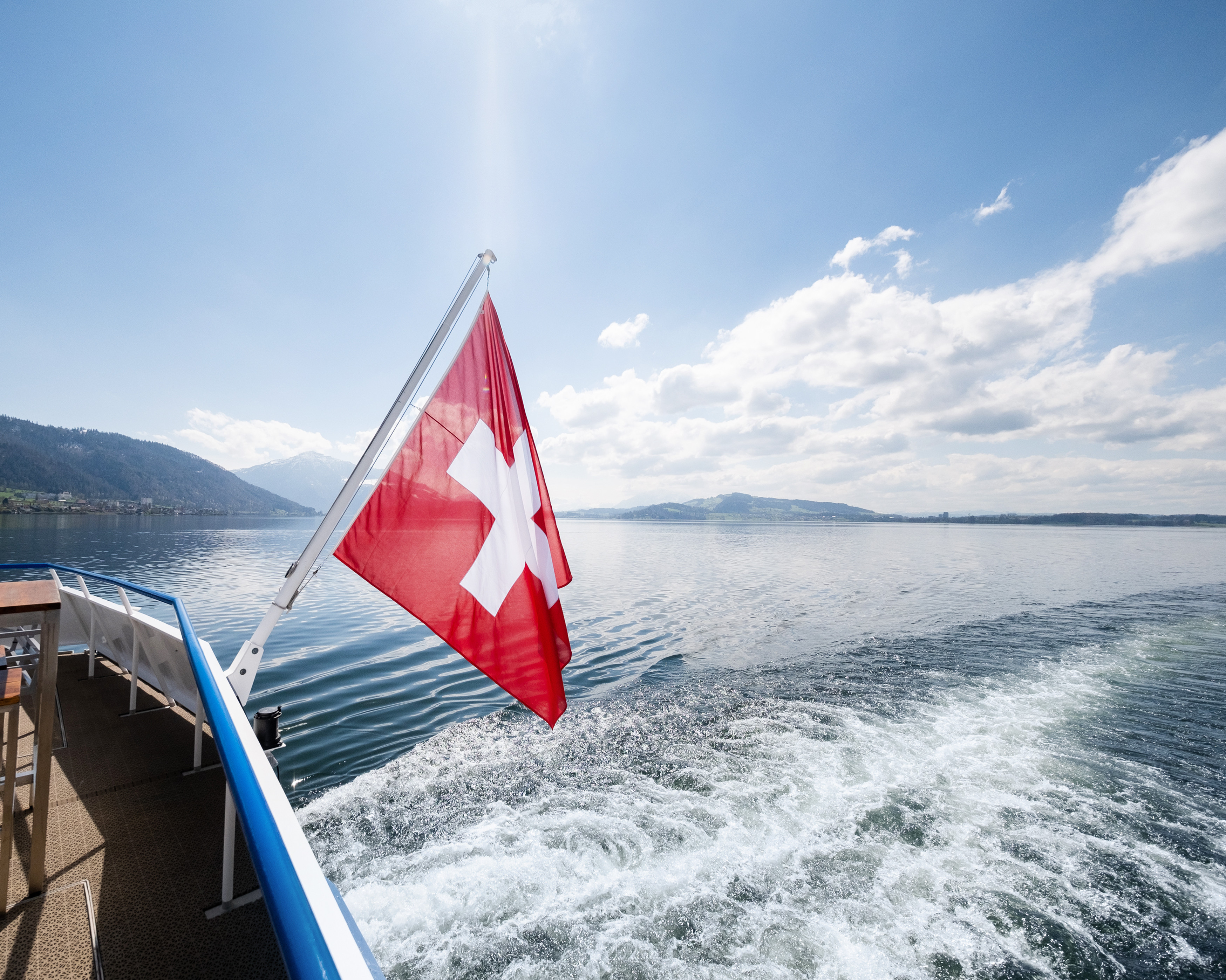 Swiss flag Flag waving at the stern of the MS Rigi on the lake